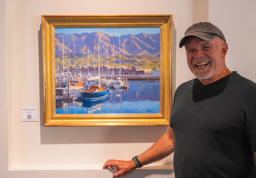 John Cosby standing by one of his works