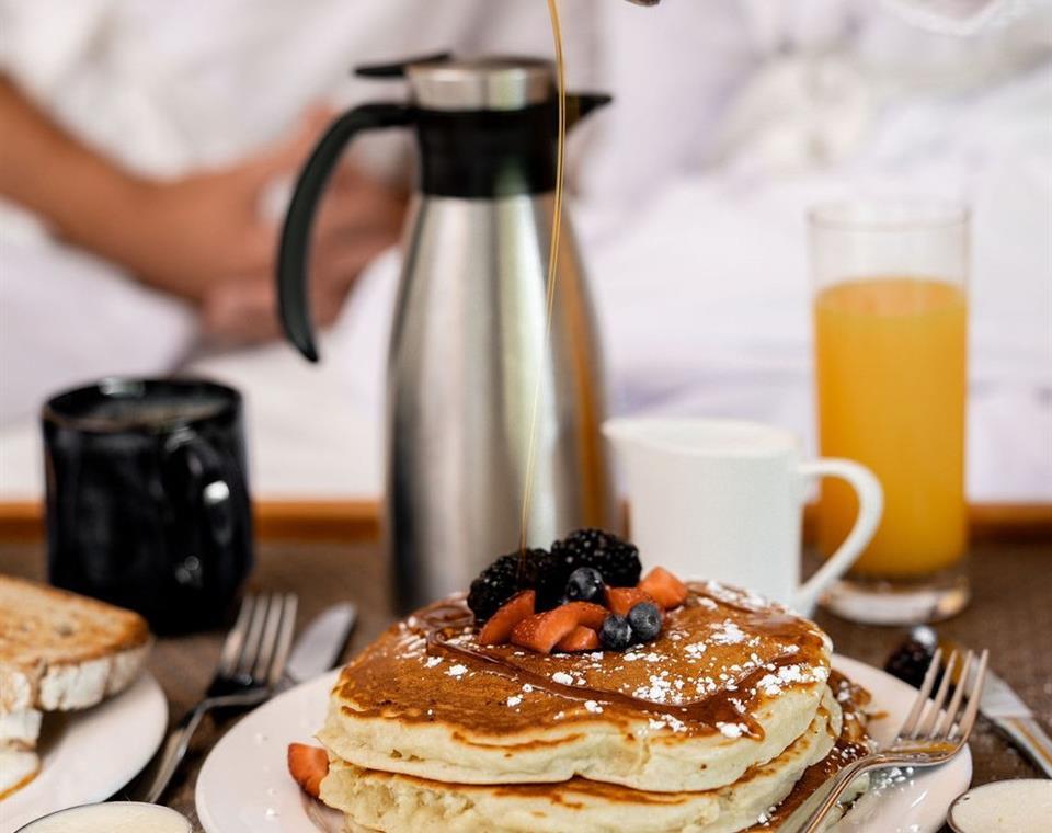 Pancakes with berries on top from room service