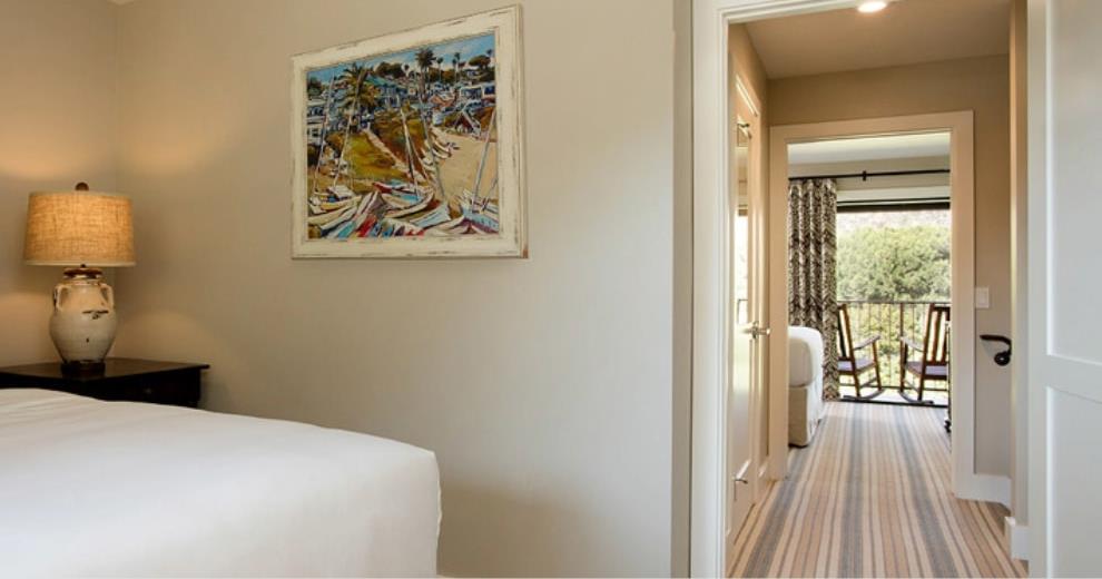 view of bedroom and hallway to the balcony